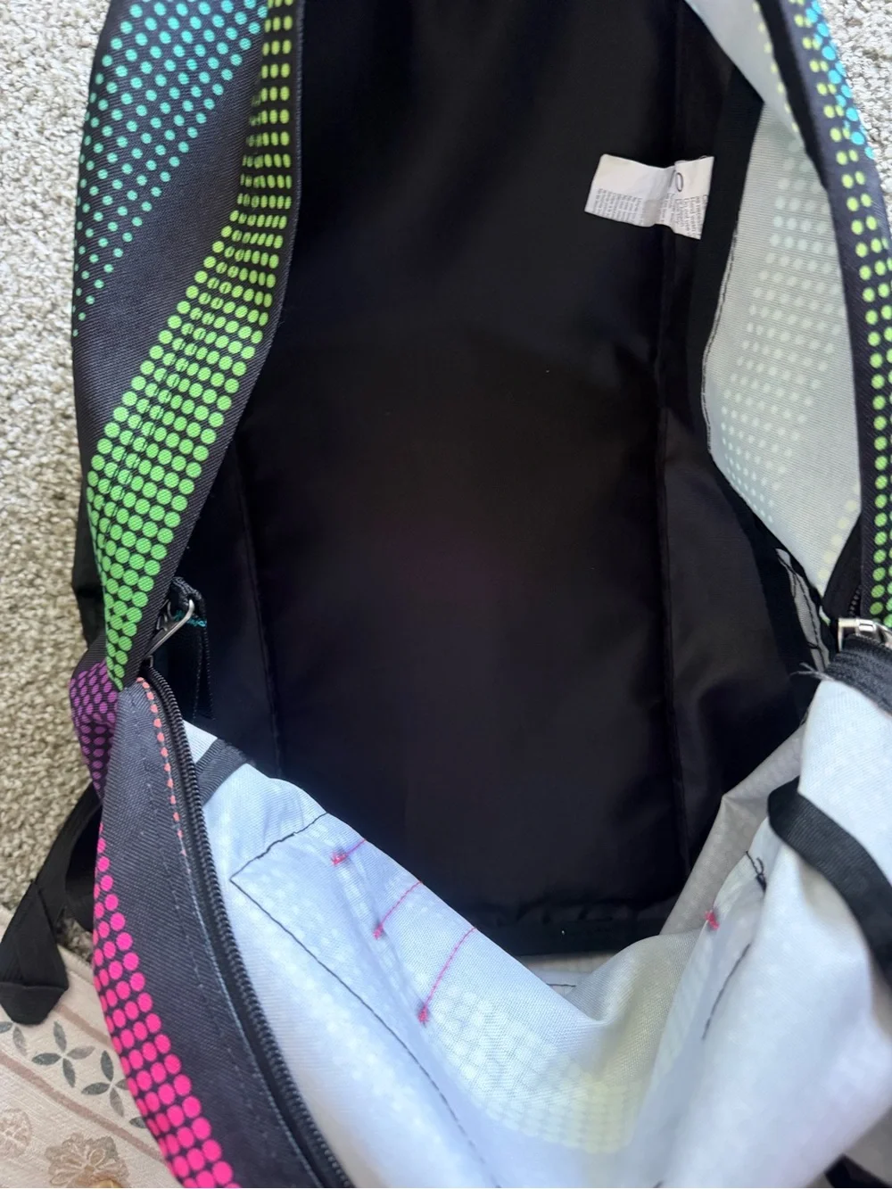 Jansport Black Backpack with Rainbow Dot-Stripe Pattern